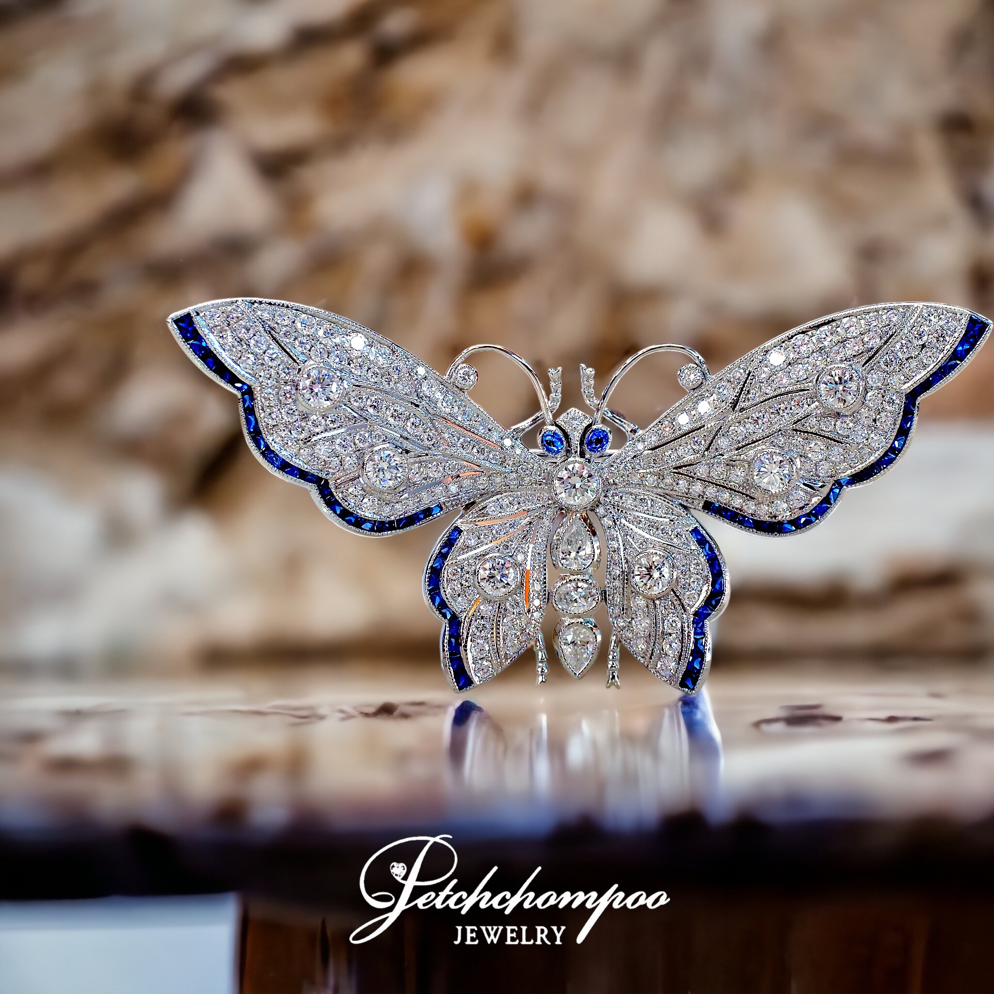 [27564] Butterfly brooch set with diamonds and sapphires.  199,000 