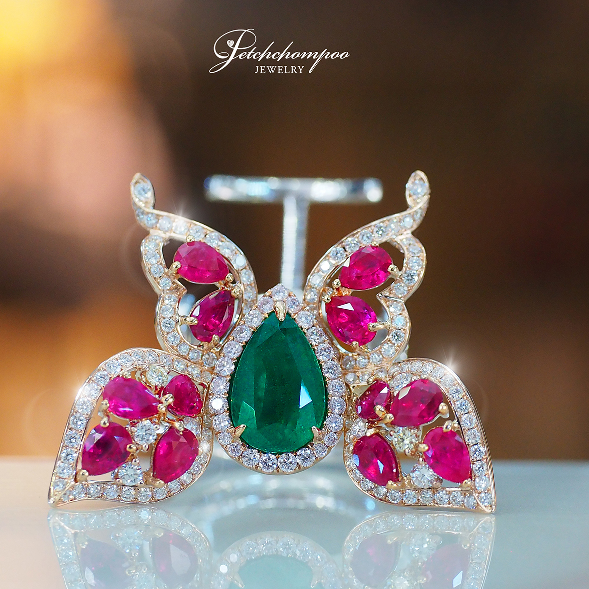 [27424] Butterfly ring set with emeralds and rubies set with diamonds.  199,000 