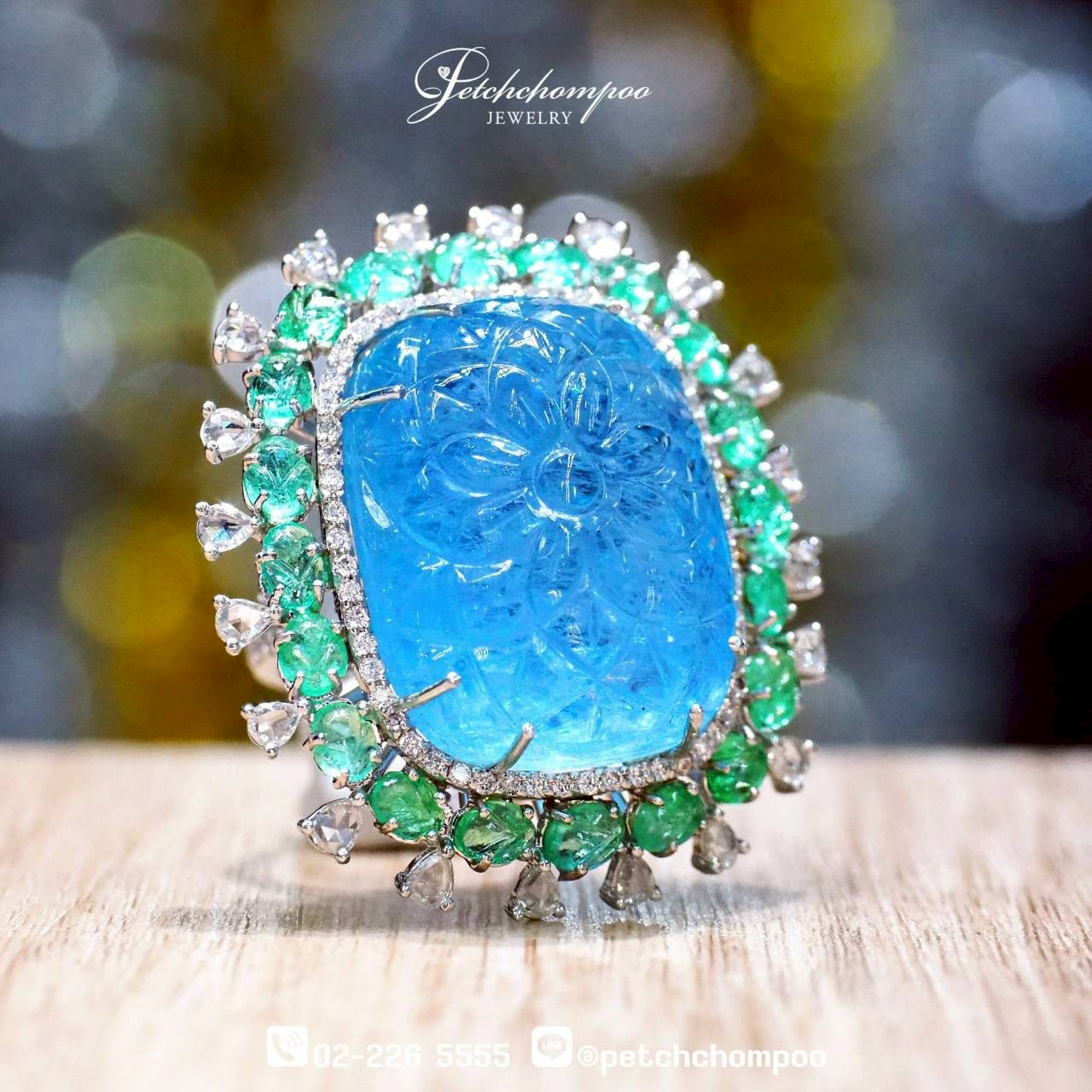 [29921] “Celestial Bloom” — 63.75 Carat Hand-Carved Aquamarine Ring with Emeralds and Diamonds  199,000 