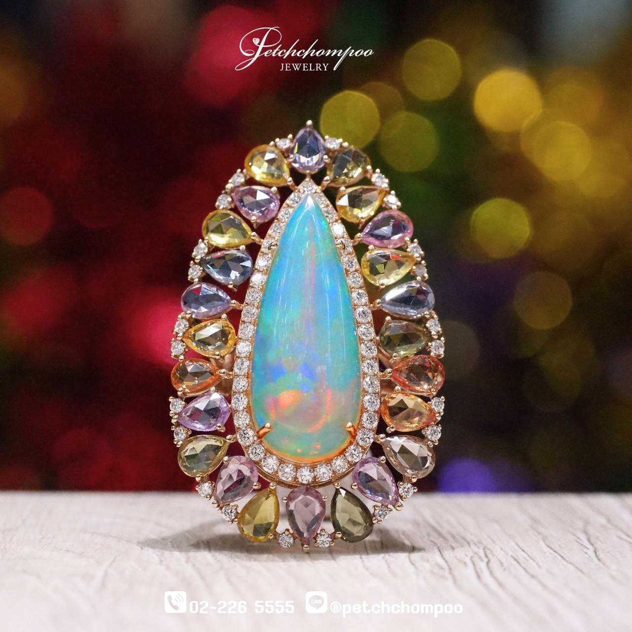 [29799] 10.05 carat Opal with sapphire and diamond ring  139,000 